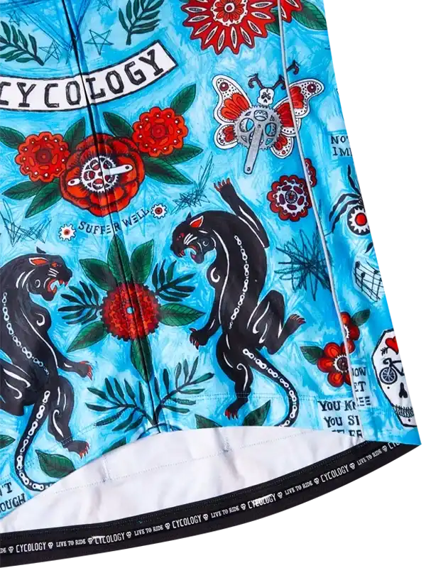 Vibrant blue cycling jersey with bold black panthers, red flowers, and 'Cycology' print for men's and women's rides.