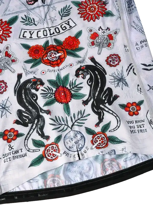 Cycology cycling jersey with bold floral and panther tattoo-style print, vibrant red flowers, and vintage graphics