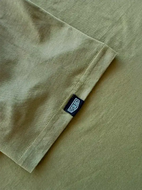Olive green cycling t-shirt with branded tag, soft fabric detail for men's and women's bike wear