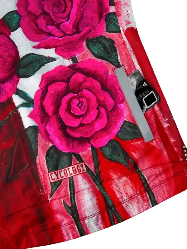Vibrant pink rose print cycling jersey with bold red accents and 'CYCOLOGY' branding