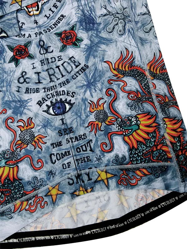 Close-up of a colorful tattoo-style fabric with dragons and text \