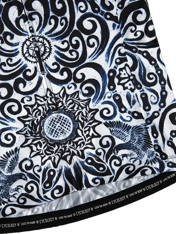 Black and white cycling jersey with intricate swirls, sunflower, and bird designs, featuring 'Live to Ride' hem text.