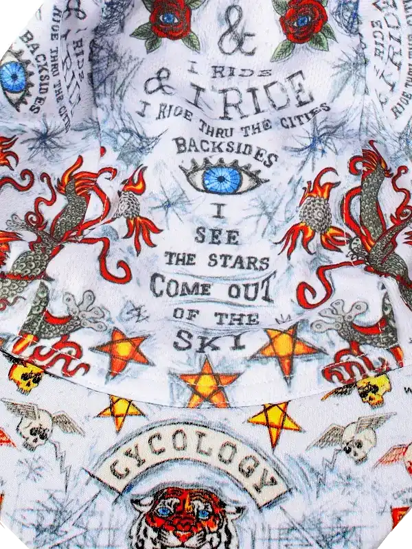 Cycling jersey with bold tattoo-style graphics, stars, dragons, and 'I ride' text on white fabric