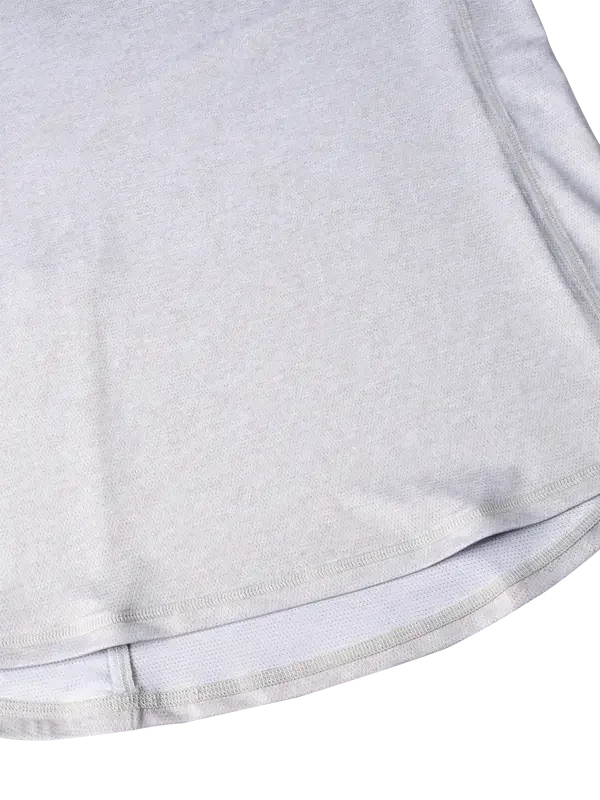Light gray cycling jersey hem with flatlock stitching and breathable fabric detail