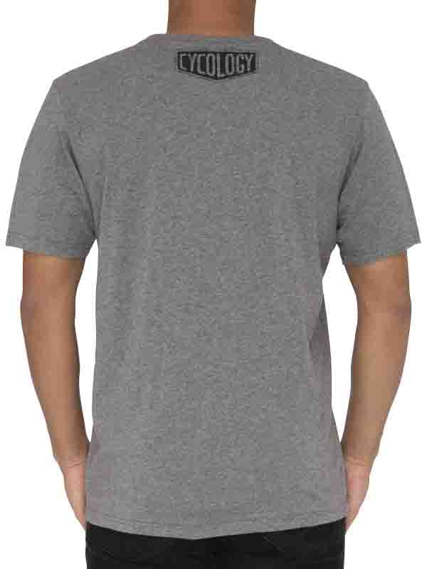 Grey t-shirt with 'Cycology' logo on the back, worn by a person.
