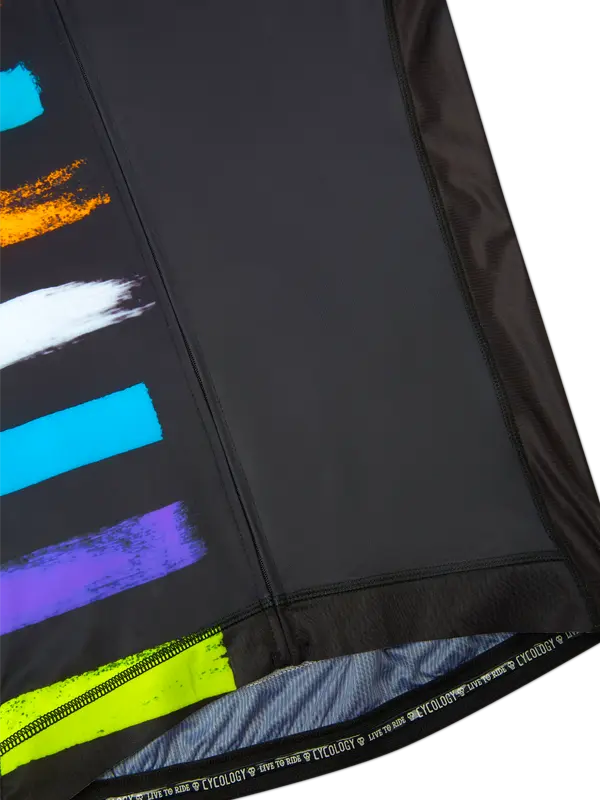 Close-up of a black jersey with colorful abstract patterns