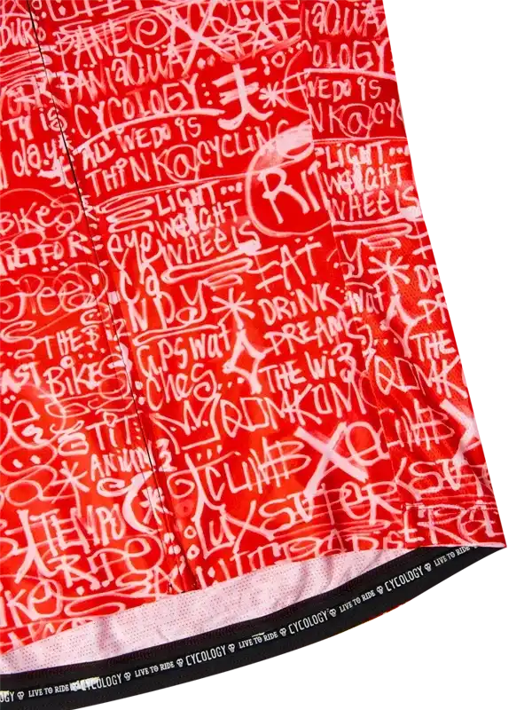 Red cycling jersey with white graffiti-style text, featuring cycling phrases and 'Cycology' branding on hem