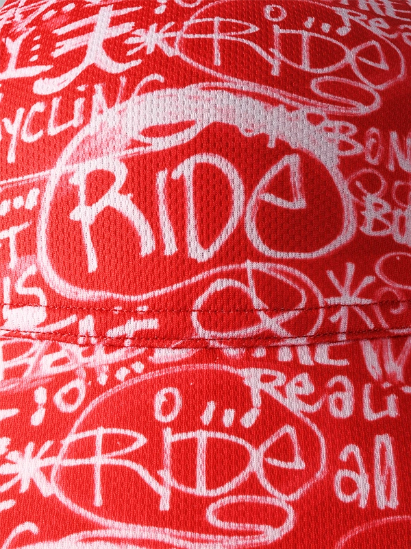 Red cycling cap with white text and graphics
