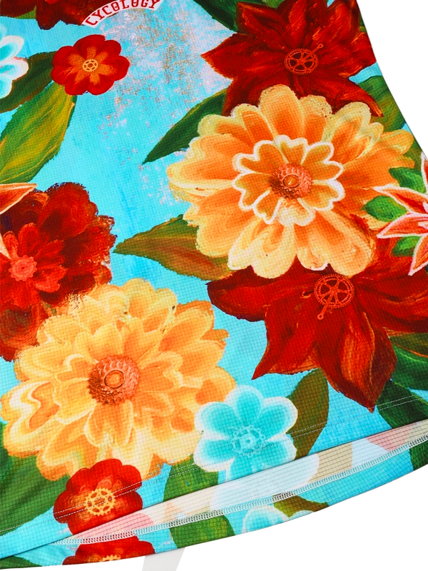 Women's colorful floral technical t-shirt with red, yellow, and orange flowers on a aqua blue background