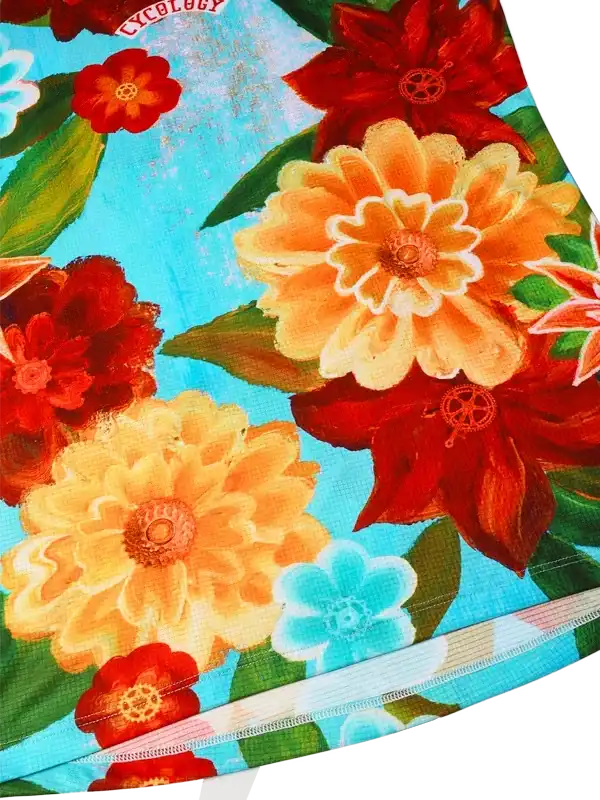 Vibrant floral cycling jersey with red, orange, and blue flowers on turquoise background, featuring bike wheel details.