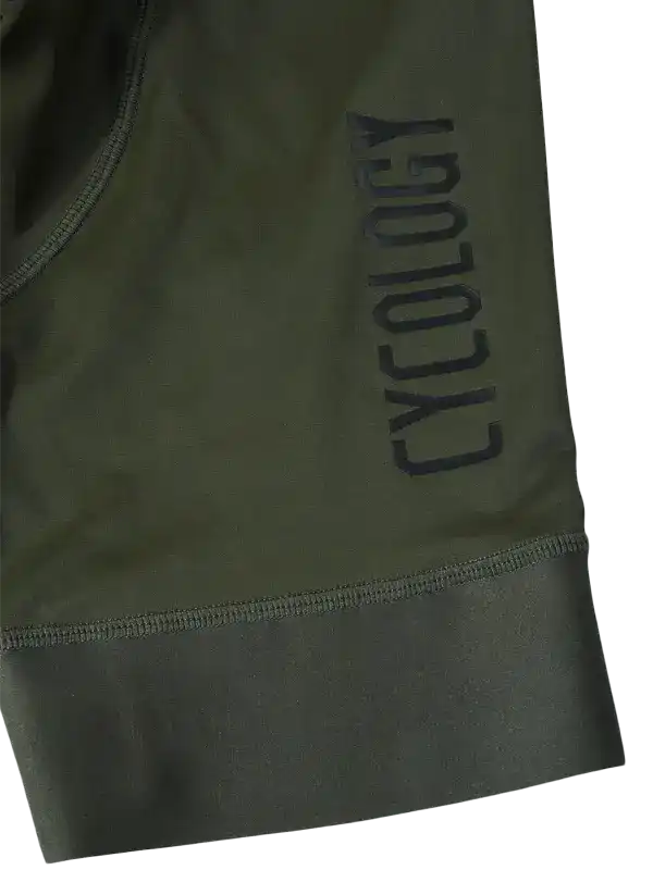 Olive green cycling shorts with 'CYCOLOGY' logo, high-quality fabric, snug fit for men and women