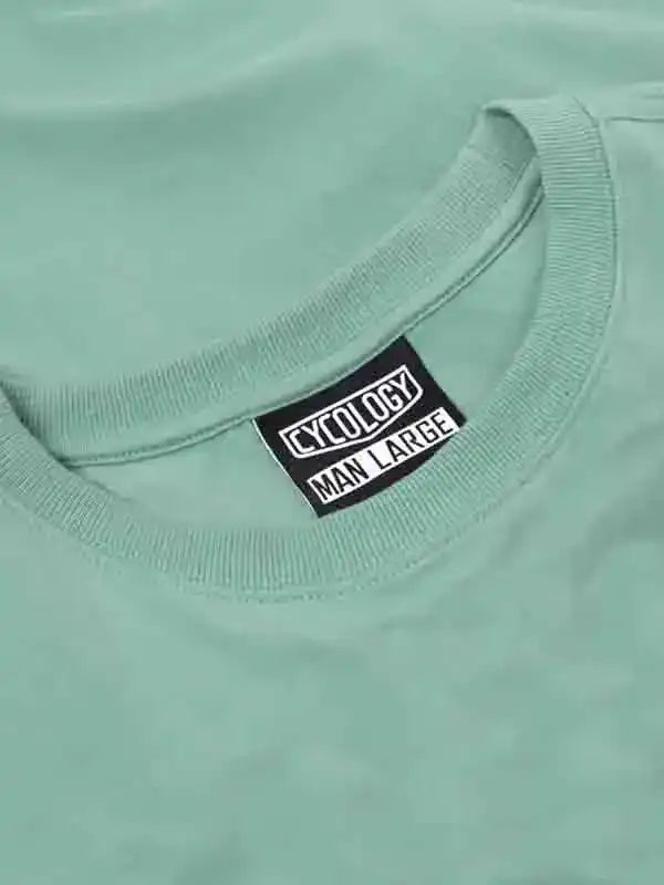 Mint green men's cycling t-shirt with Cycology brand tag, size large, soft fabric detail