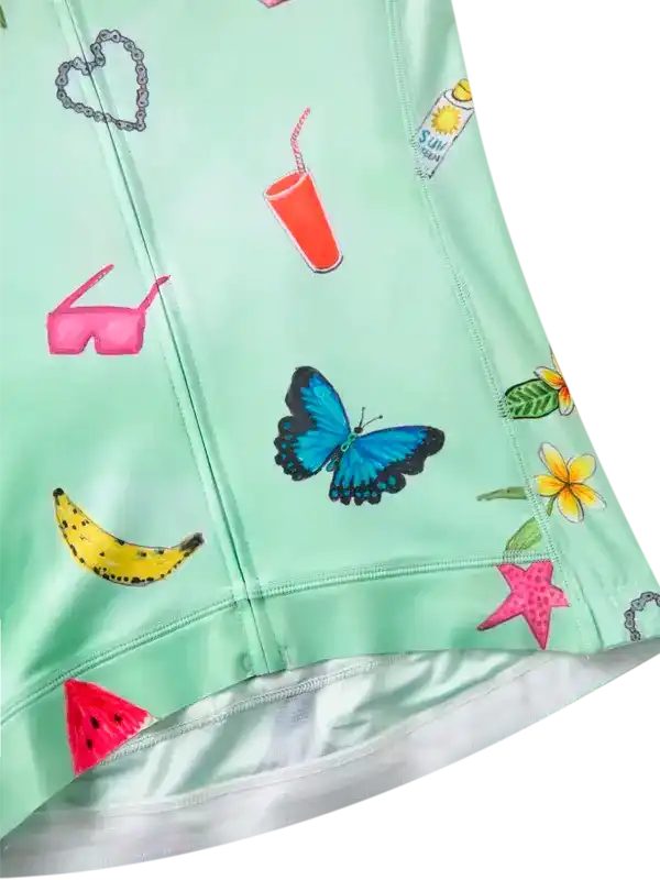 Light green fabric with colorful prints including a butterfly, banana, and watermelon