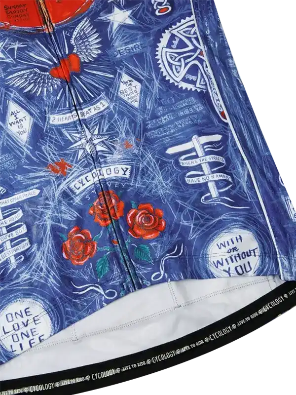 Blue cycling jersey with red roses, wings, and tattoo-style graphics, featuring 'Cycology' branding