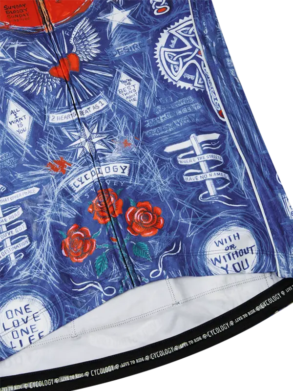 Close-up of a blue cycling jersey with white text and red roses, featuring the brand 'Cycology