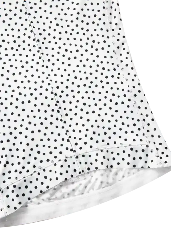 Close-up of a white fabric with black polka dot pattern