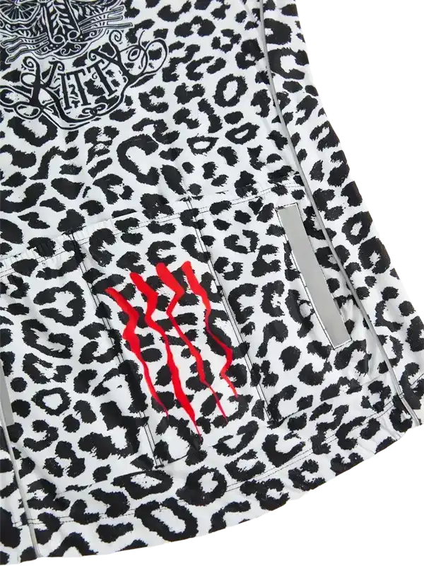 Women's cycling jersey with black and white leopard print, red claw mark design, and reflective strip