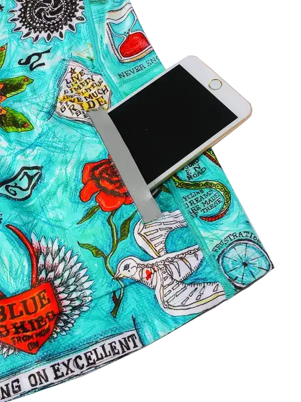 Cycling jersey with vibrant turquoise print, floral and graphic designs, featuring phone pocket for riders