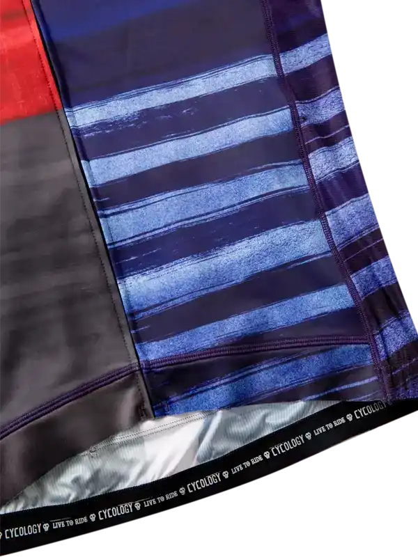 Close-up of a folded fabric with blue and black striped pattern, featuring the brand 'Cycology'.