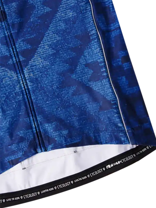 Blue patterned cycling jersey with white hem and brand text detail
