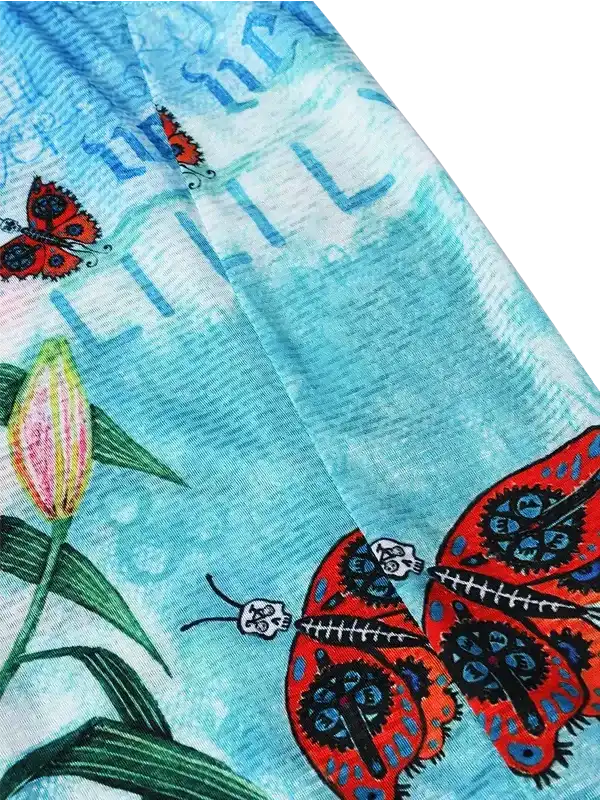 Cycling jersey with red butterfly and skull design on blue fabric, unique men's and women's apparel