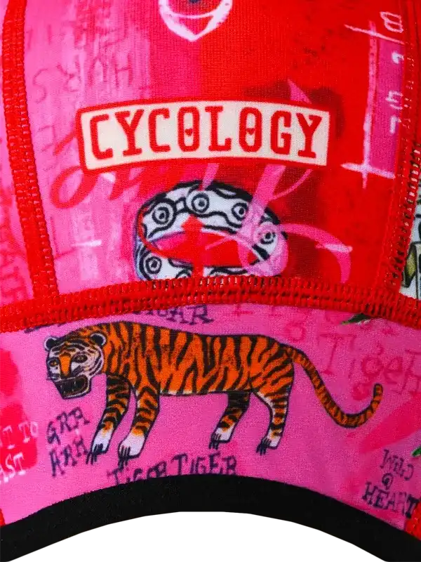 Vibrant pink and red cycling cap with tiger graphic and 'CYCOLOGY' logo, ideal for bike riders