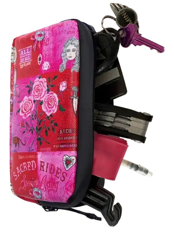 Pink floral cycling key pouch with keys and tools, ideal for bike riders