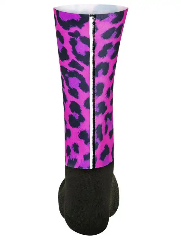 Vibrant pink and purple leopard print cycling leg warmer with black base and white zipper detail