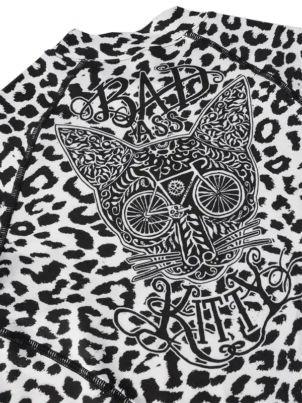 Badass Kitty leopard print cycling jersey with intricate cat and bike graphic design