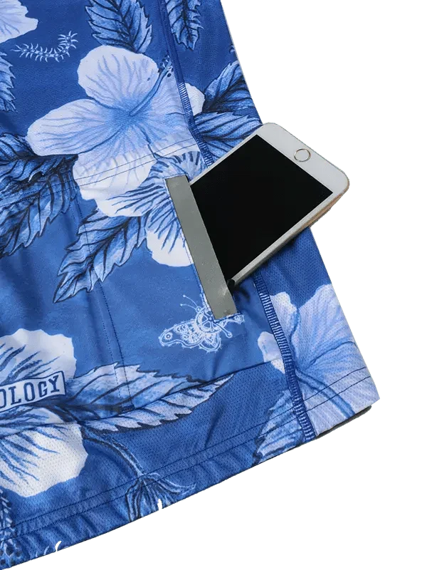 Blue floral cycling shorts with phone pocket, featuring hibiscus print and breathable fabric for men's or women's rides.