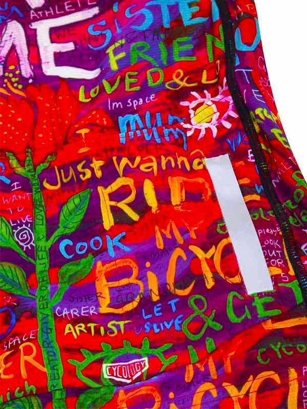 Colorful cycling jersey with bold text art, 'Just Wanna Ride My Bike' design, vibrant graphics for cyclists