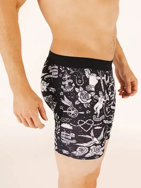 Men's cycling shorts with tattoo-style print, featuring roses, anchors, and vintage motifs for active wear.