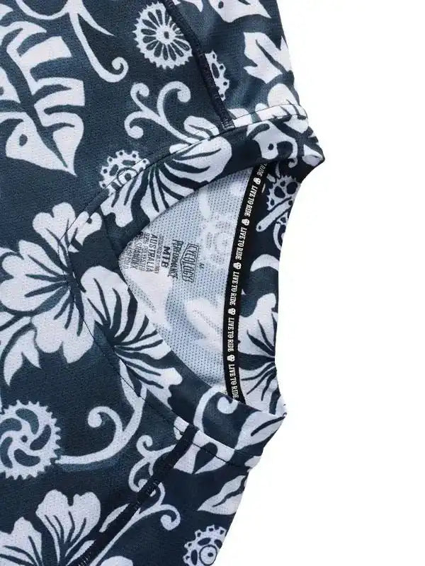 Black and white floral cycling jersey with performance fabric and 'Live to Ride' tag detail