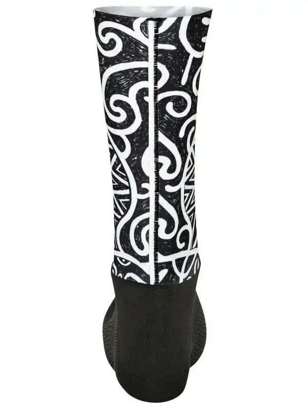Black and white patterned cycling arm warmer with bold swirl design for men and women