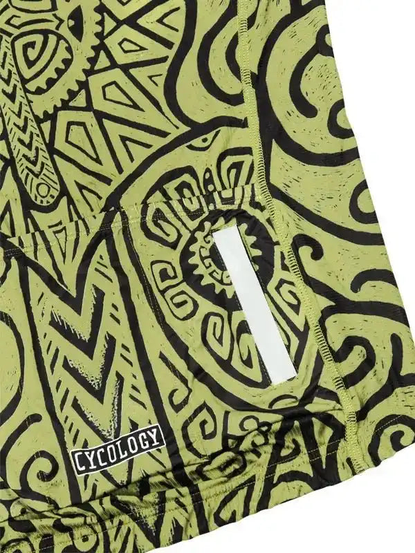 Green cycling jersey with bold black tribal patterns and rear pocket, featuring Cycology logo