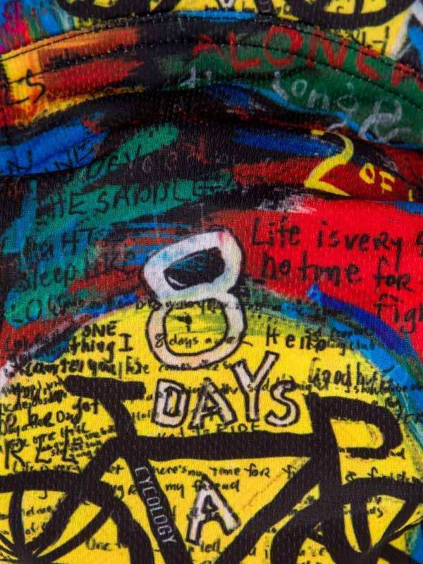 Vibrant cycling jersey with '8 DAYS A WEEK' graphic, bold colors, and bike silhouette design