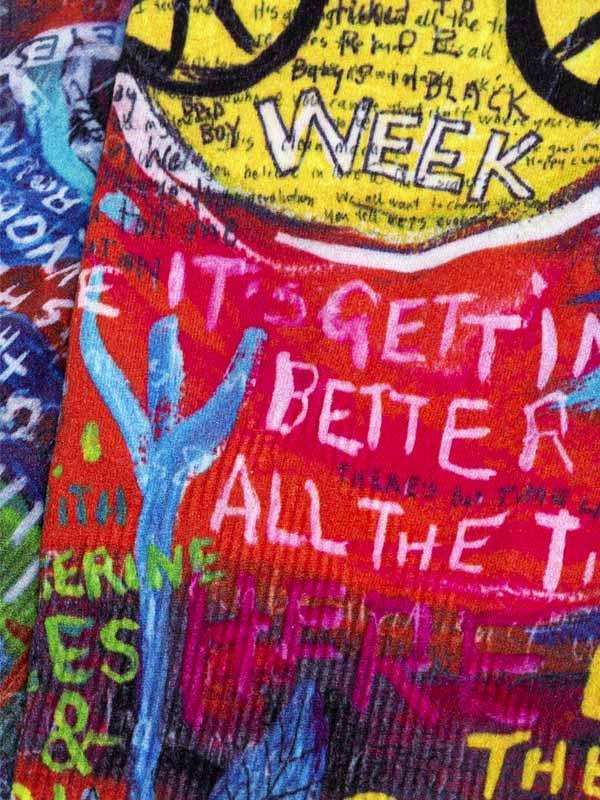 Vibrant cycling jersey with bold graffiti-style text and colorful graphics for men's and women's rides
