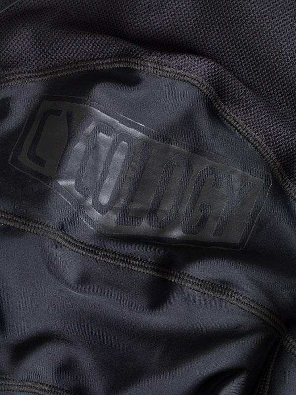 Cycology branded cycling jersey detail with textured fabric and logo patch