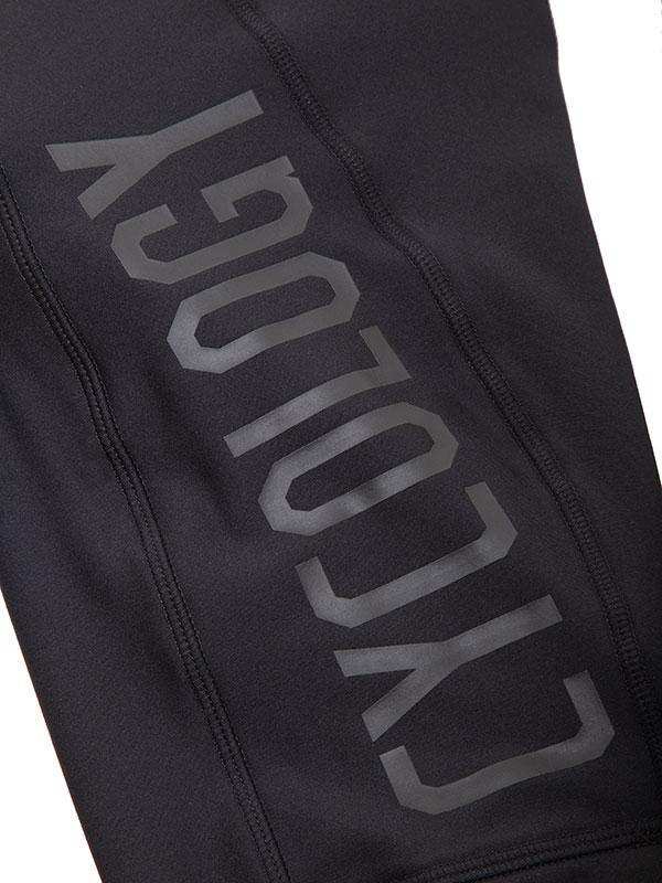 Black cycling legging with bold 'CYCOLOGY' logo, performance fabric for men's and women's rides