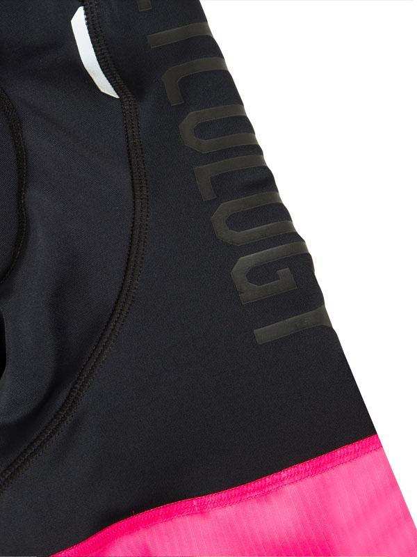 Black cycling shorts with pink trim and 'Cycology' branding, ideal for performance rides.