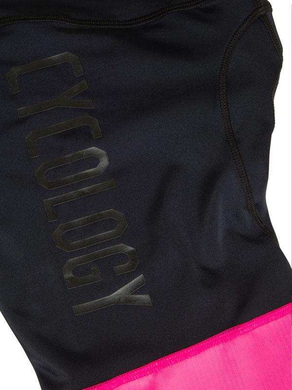 Black cycling jersey with bold 'CYCOLOGY' logo and vibrant pink hem, designed for performance and style.