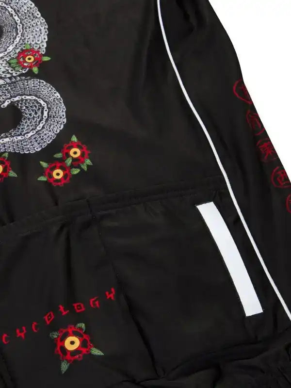 Black cycling shorts with red floral embroidery, chain design, and reflective stripe for men's or women's rides