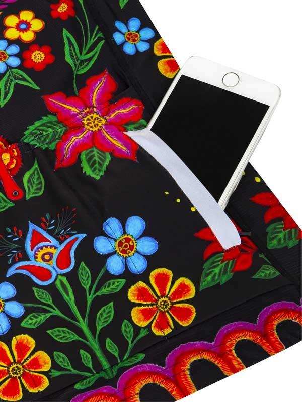 Black cycling shorts with vibrant floral print and phone pocket, ideal for women's bike rides.