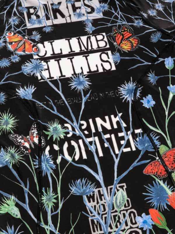 Black cycling jersey with 'CLIMB HILLS' text, butterflies, blue flowers, and coffee slogan design