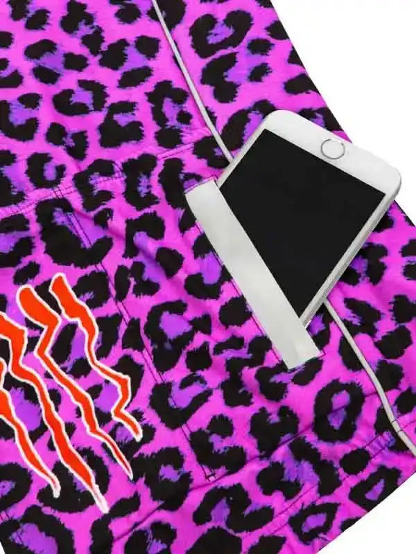 Vibrant pink leopard print cycling shorts with bold orange graphic and phone pocket