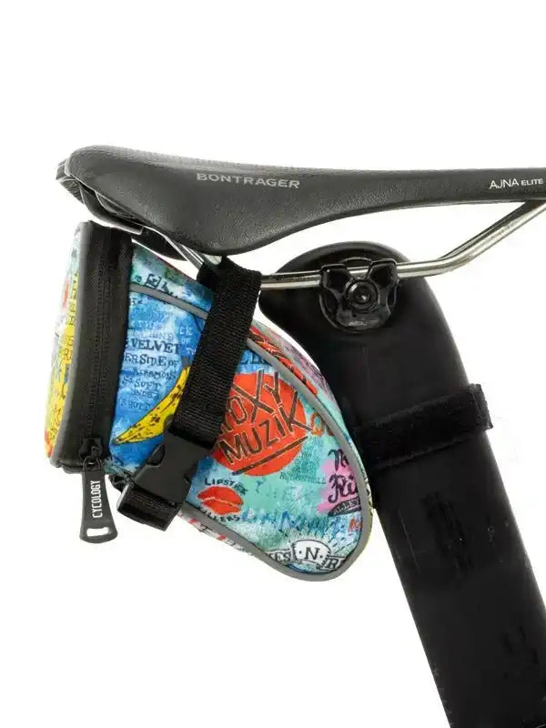 Colorful cycling saddle bag with retro music print, attached to Bontrager bike seat for storage