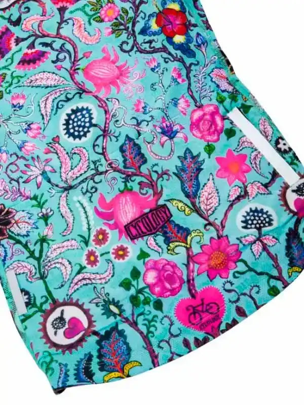 Vibrant floral cycling shorts with pink and teal botanical print, ideal for women's bike wear
