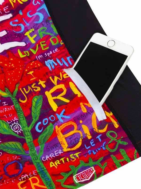 Colorful cycling jersey pocket holding phone, vibrant graffiti-style design with empowering words