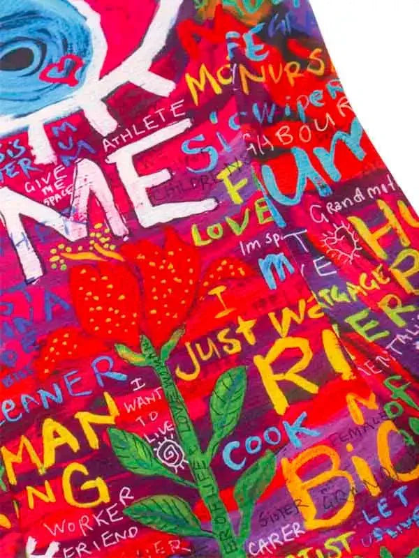 Vibrant cycling jersey with bold graffiti-style text and floral design, perfect for men's and women's bike wear.