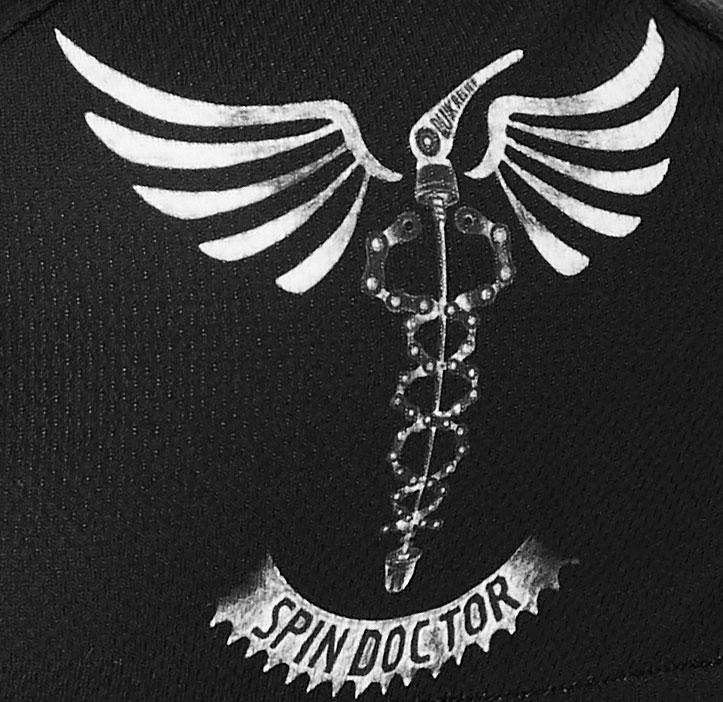 Spin Doctor cycling jersey graphic with wings and chain design on black fabric